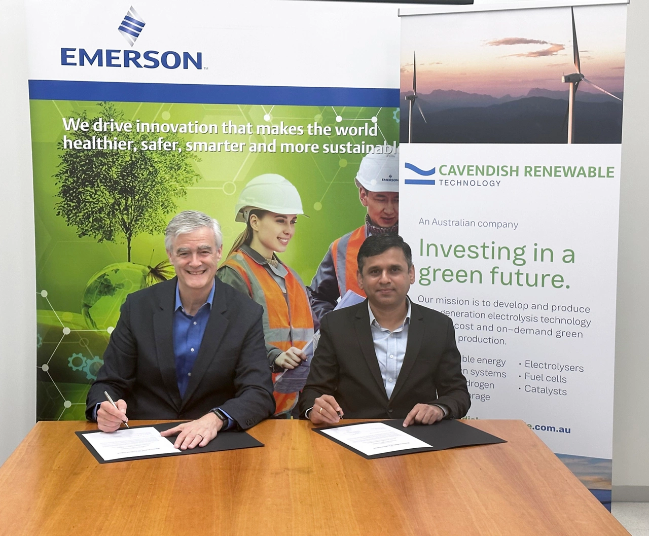 Emerson's Mike Train and CRT CEO Ani Kulkarni, Ph.D., sign MoU at Cavendish Renewable Technology