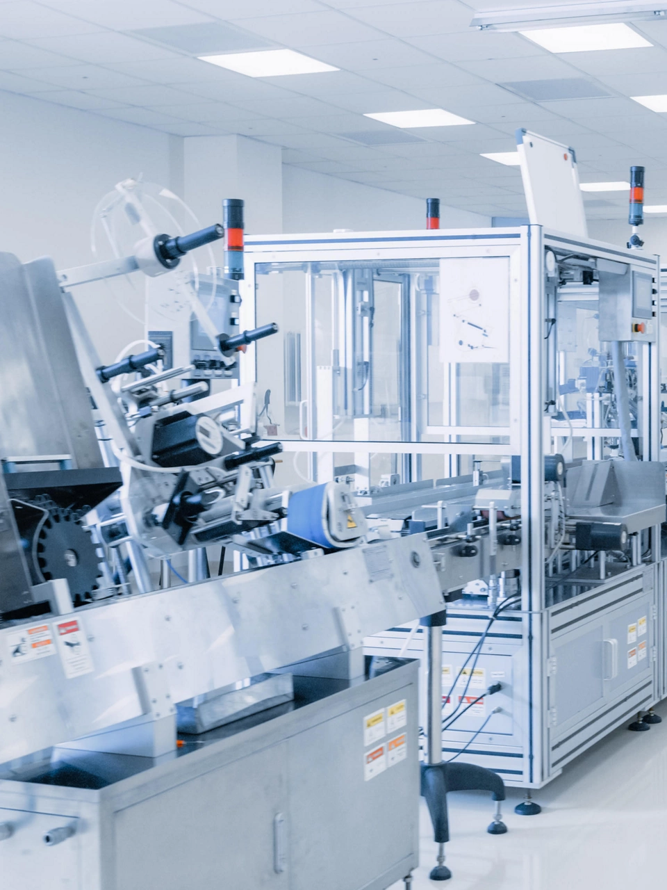Shot of Sterile Pharmaceutical Manufacturing Laboratory where Scientists in Protective Coverall's Do Research, Quality Control and Work on the Discovery of new Medicine.