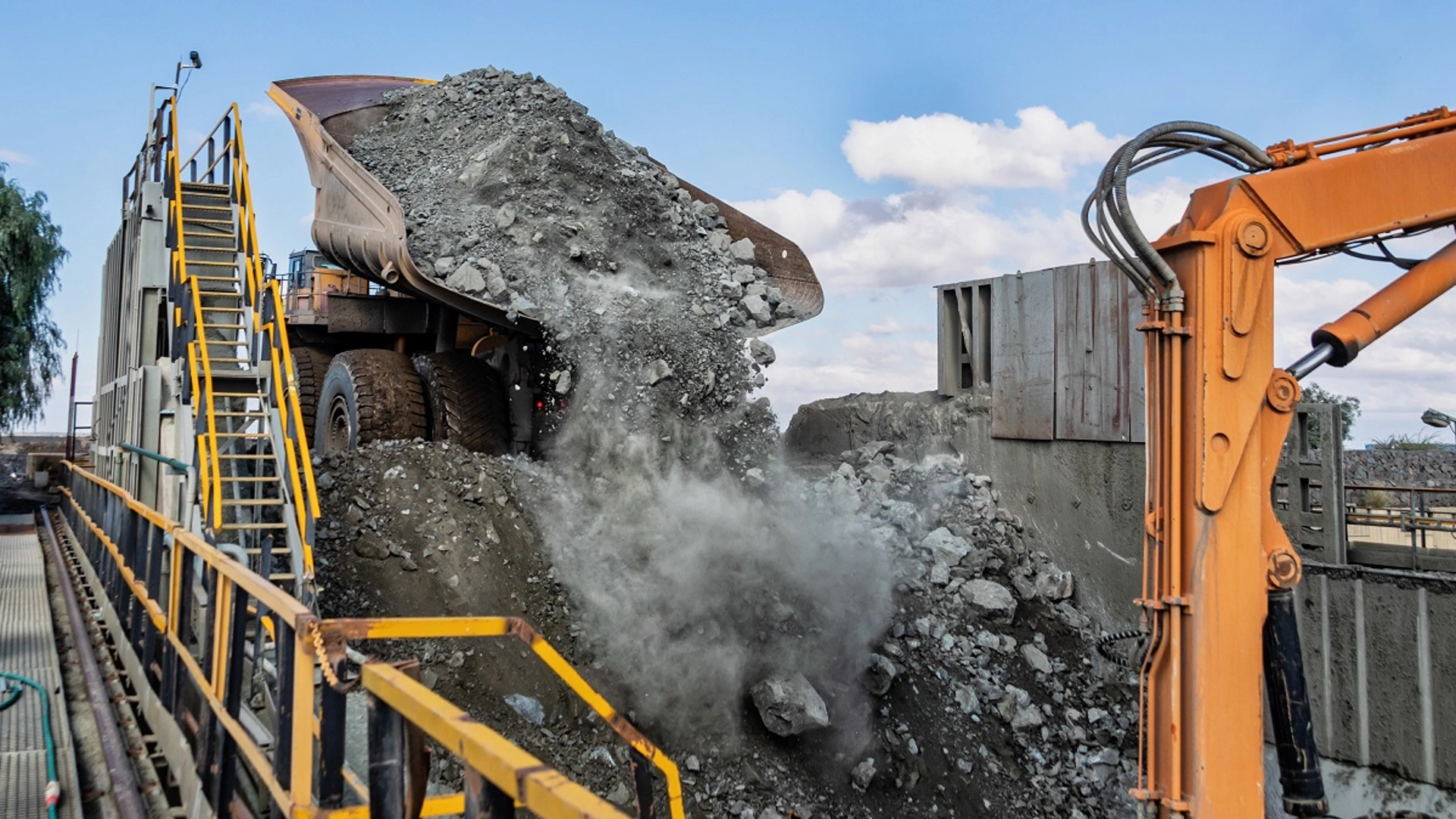 Huge truck unloading kimberlite in a crusher in an open pit diamond mine , in Botswana