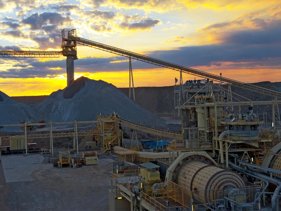 Sunset over mine, red sunset reflecting over the metals of the mine infrastructure Australia.