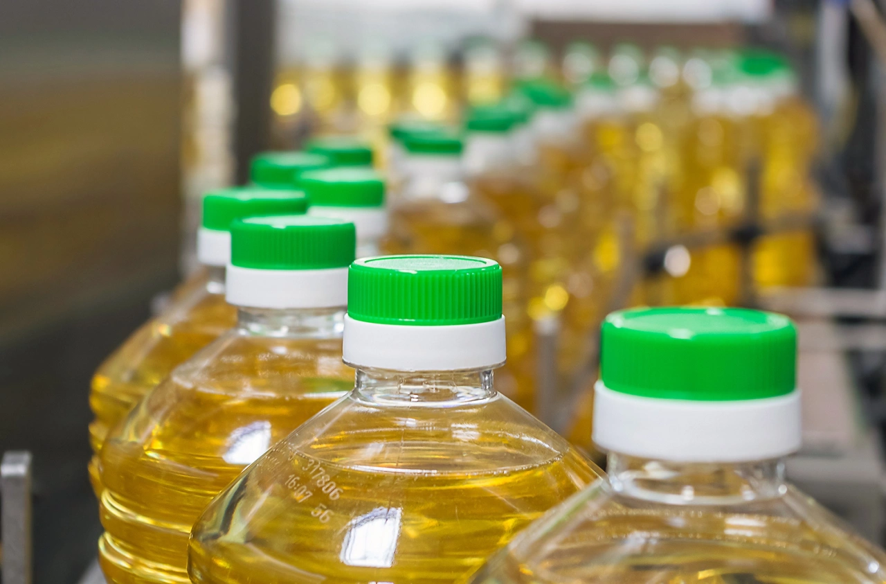 Bottle with sunflower oil on the conveyor