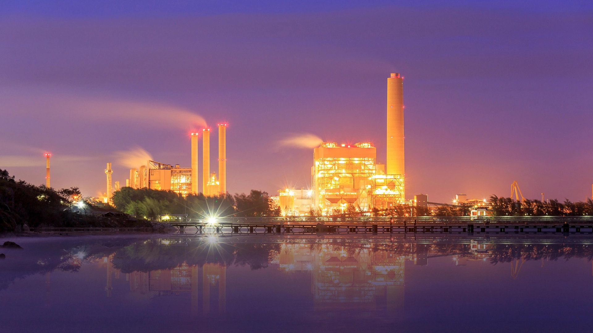 Oil refinery at twilight, behind the sea, Map Ta Phut, Rayong, Thailand
