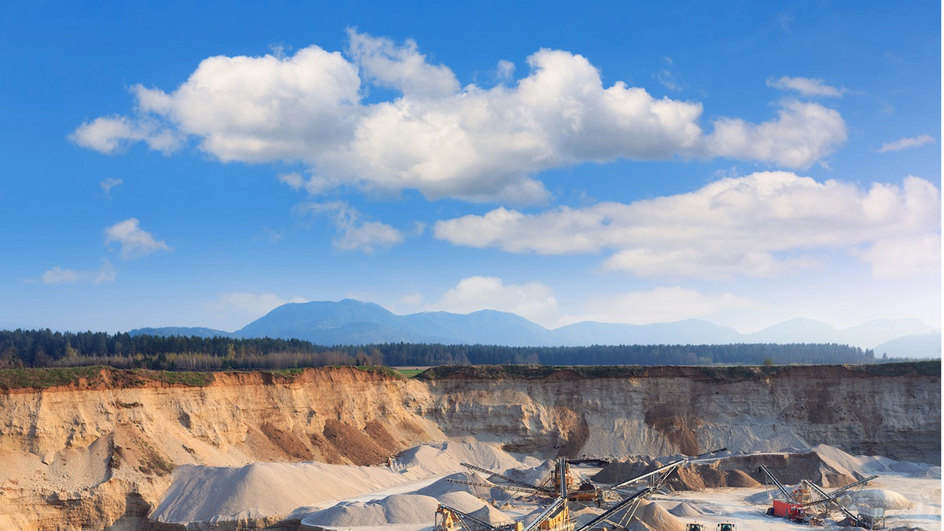 Rock quarry with trucks and all equipment.