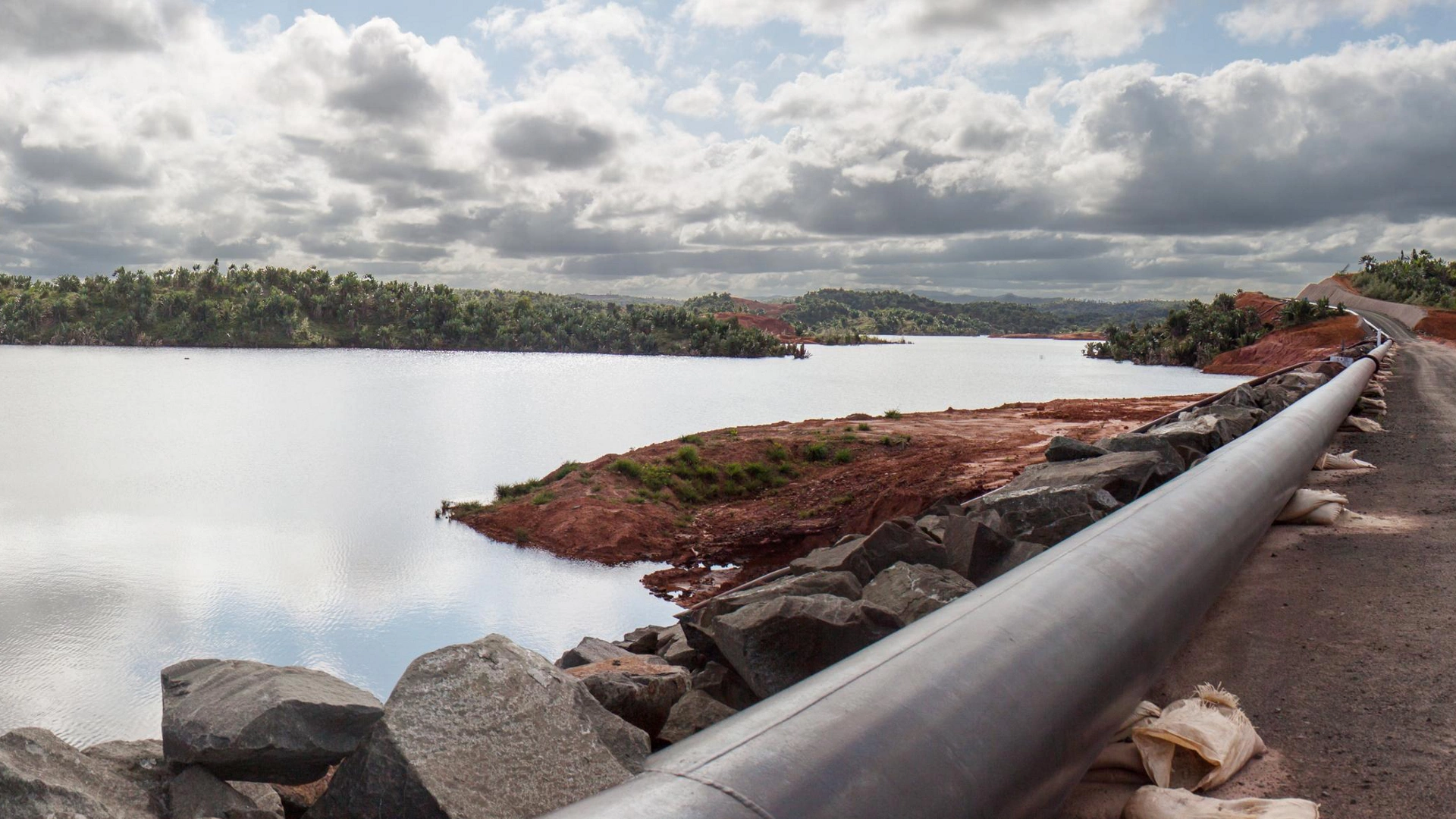 Mine tailings reservoir in Magadascar, receiving slurry through a pipeline from an ore processing plant 