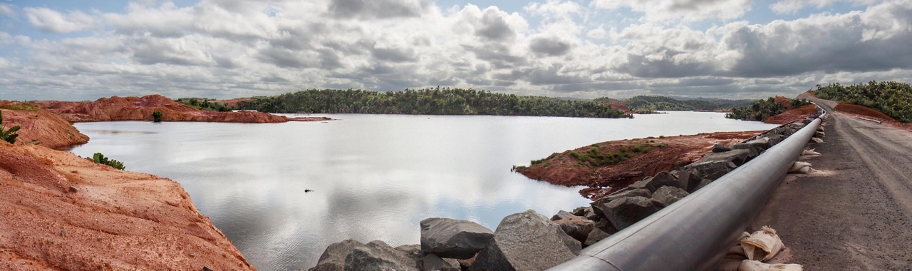 Mine tailings reservoir in Magadascar, receiving slurry through a pipeline from an ore processing plant 