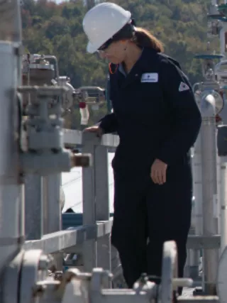 Industrial worker in safety gear outdoors